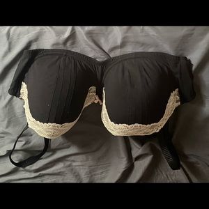 Adore Me Black bra with lace detailing and pink bow